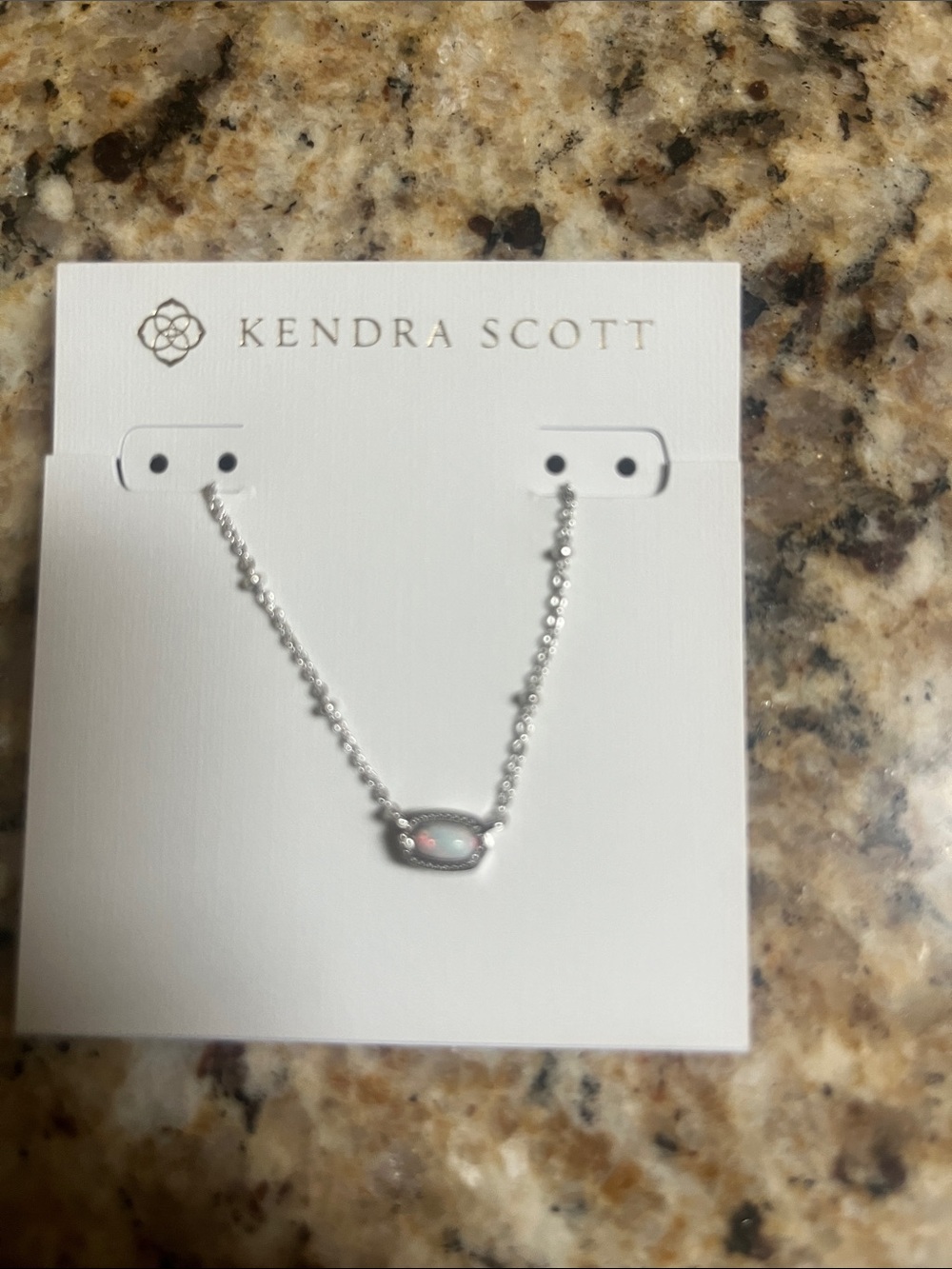 Silver Kendra Scott necklace with white/pearl pendant.